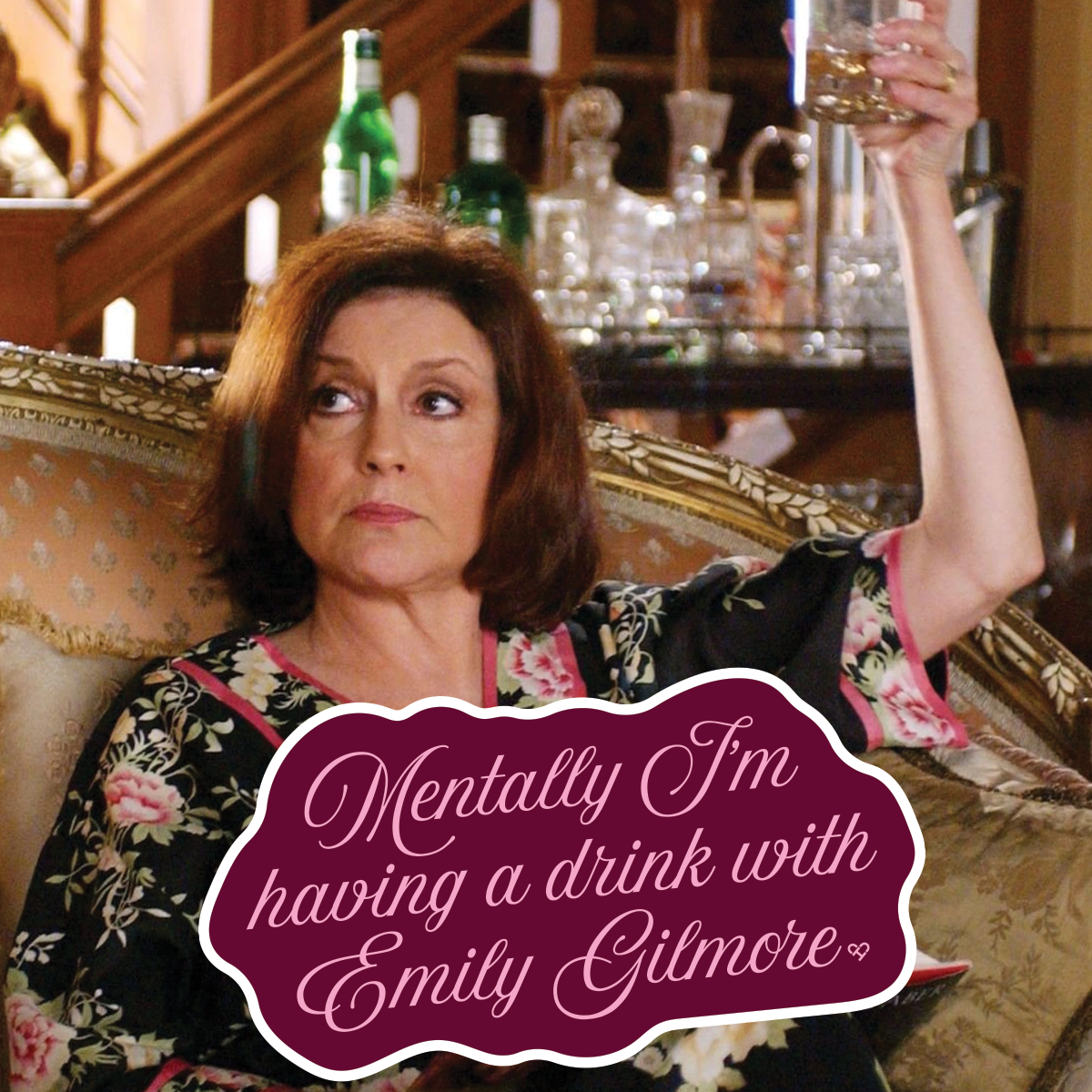 Mentally I'm Having a Drink With Emily Gilmore Sticker mockup over a still of a woman raising a glass on a sofa