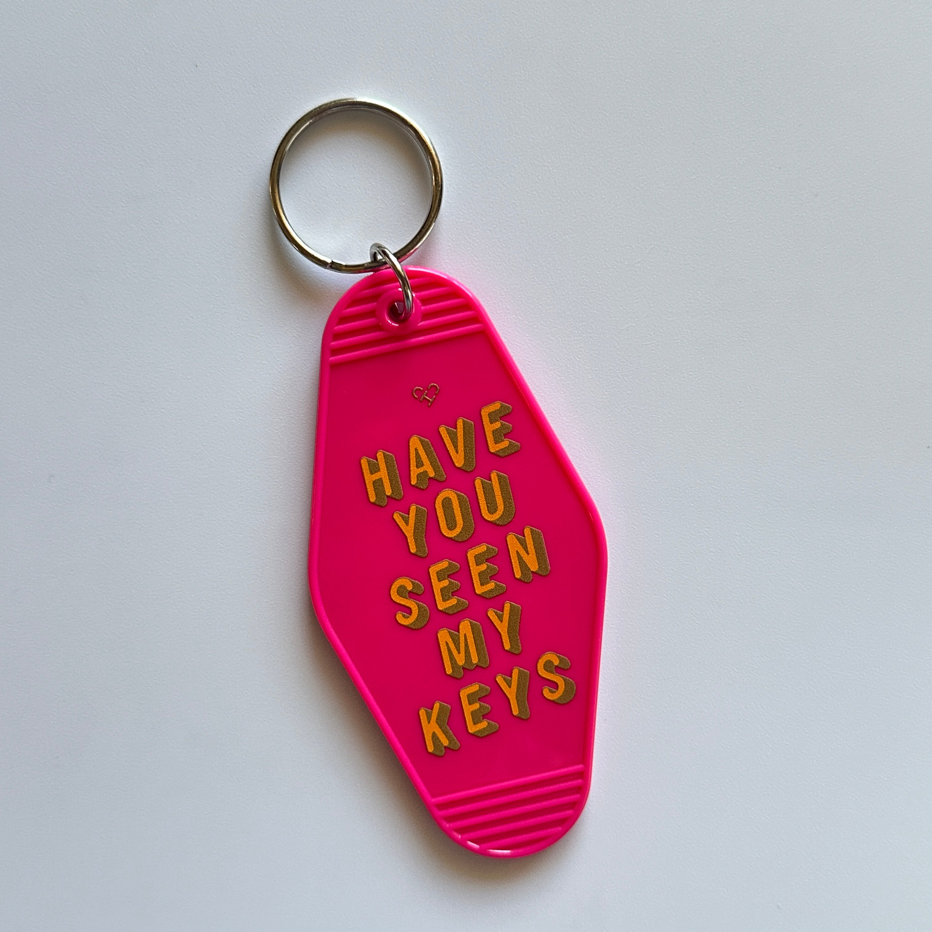 Have You Seen My Keys Motel Keychain, hot pink motel style key tag with orange lettering and silver ring on white