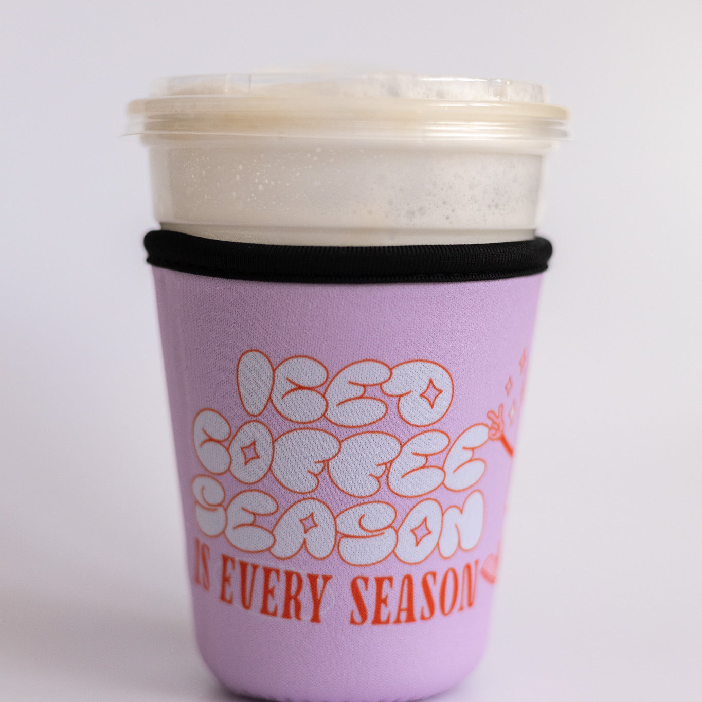 Iced Coffee Season Is Every Season Sleeve, lavender sleeve with white bubble letters and orange text on an iced coffee