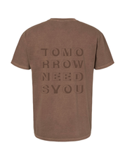 Tomorrow Needs You Short Sleeve, back of brown tee with large tonal stacked block letters reading Tomorrow Needs You